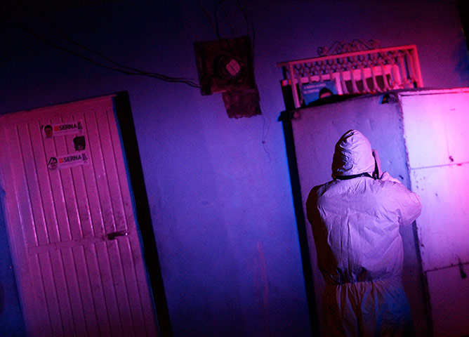 20 Photos: A forensic technician takes pictures