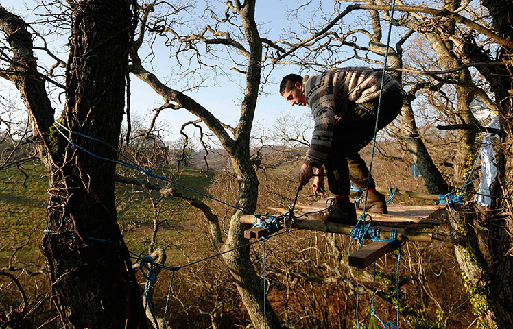 24 hours: An activist secures himself to an aerial platform