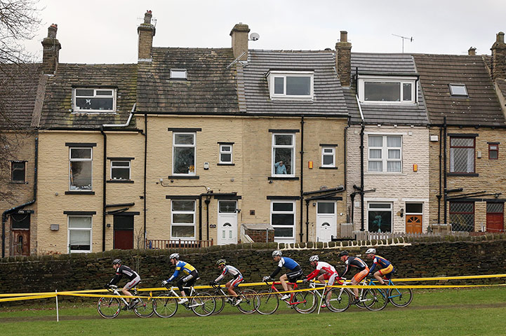 Cyclo-cross: A person watches from a window 