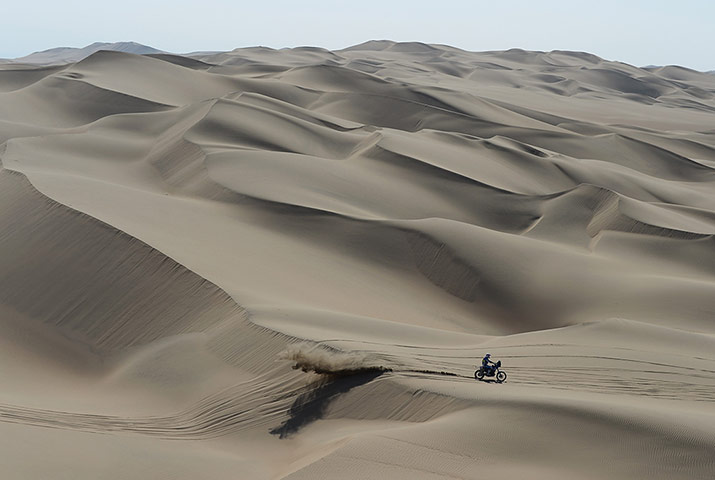 Dakar 2013:  A rider crosses the dunes 