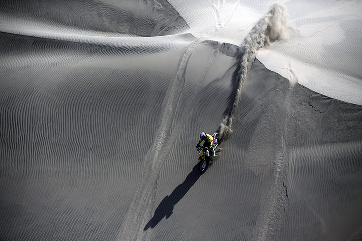 Dakar 2013: Claudio Rodriguez powers his Honda down a dune
