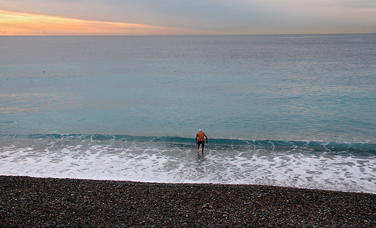 24 hours: Nice, France: A man goes swimming in the Mediterranean