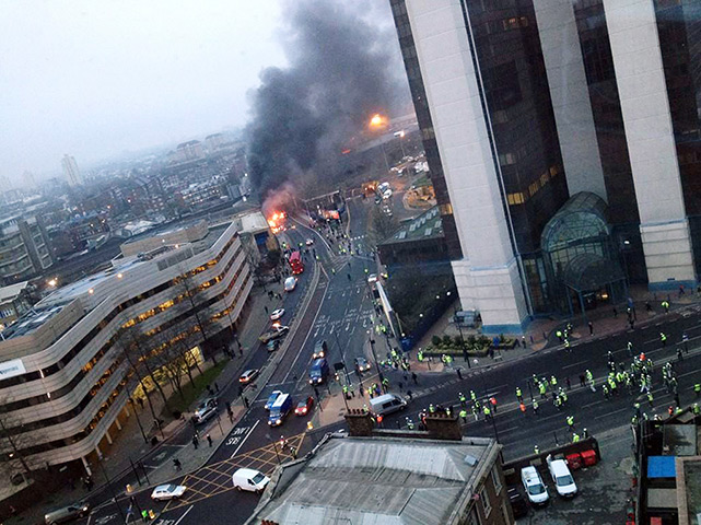 Helicopter crash: Smoke pours from the burning debris of a helicopter which crashed