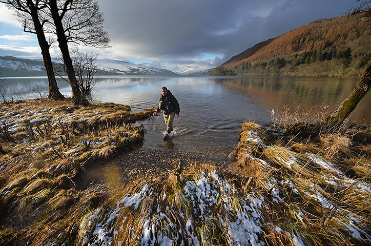 24 hours: Kenmore, Scotland: An angler casts during the opening salmon fishing season