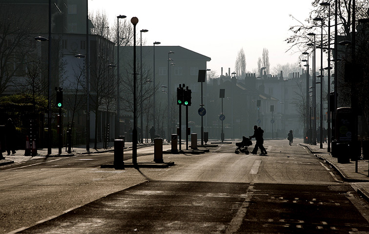 Crash aftermath: People walk across the deserted Wandsworth Road