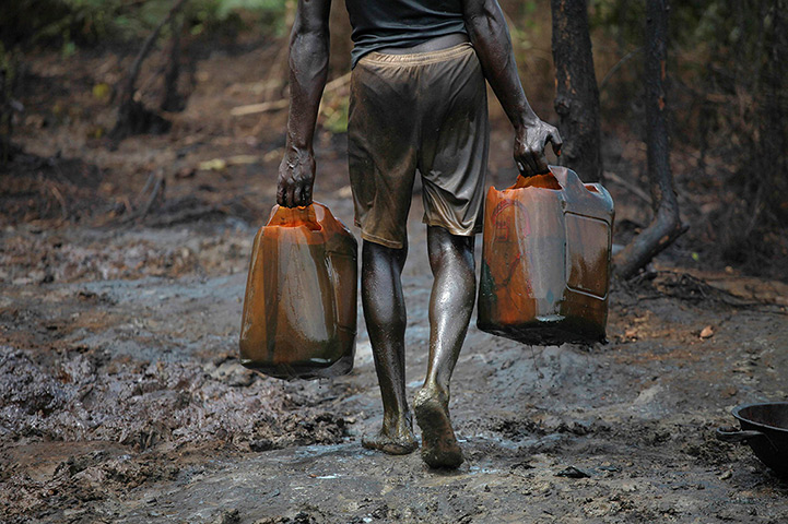 from the agencies: Illegal oil refinery in Nigeria by Akintunde Akinleye