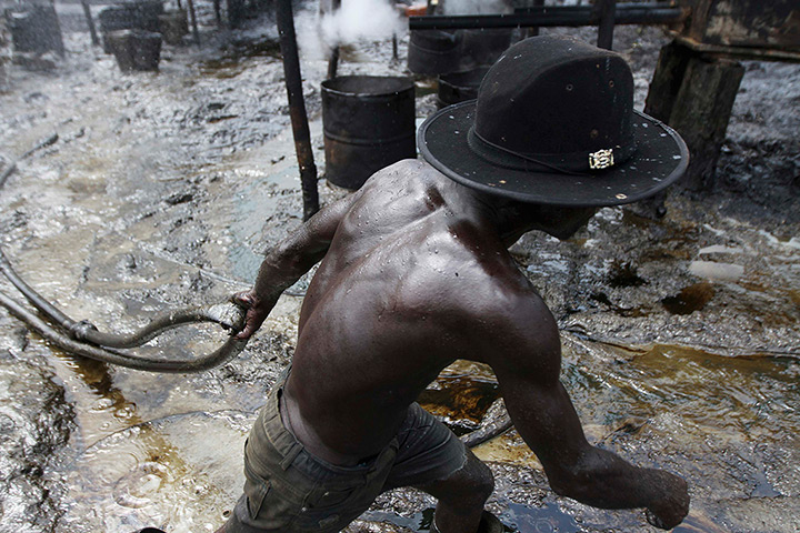 from the agencies: Illegal oil refinery in Nigeria by Akintunde Akinleye