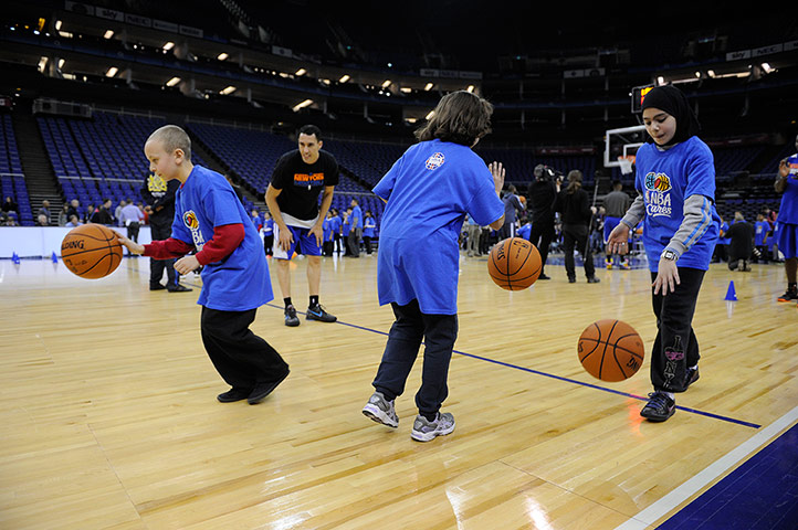 NBA training: Some local primary school children practice their dribbling