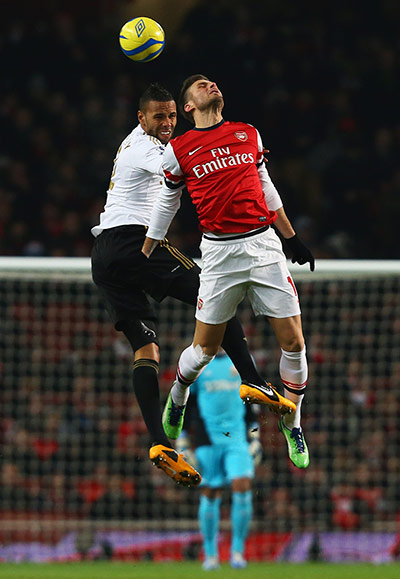 FA Cup replays: Kyle Bartley and Olivier Giroud go up for a header