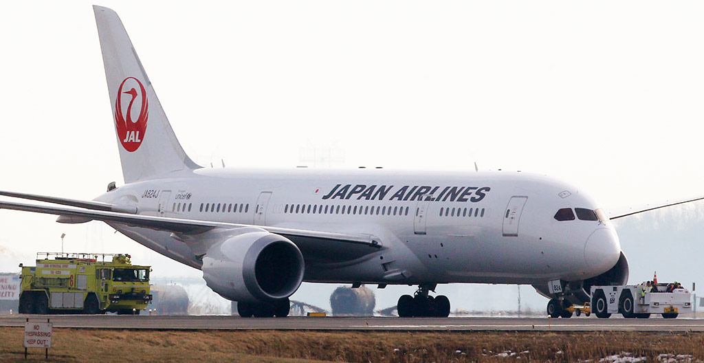 8 January: A Japan Airlines 787 is escorted by a fire engine 