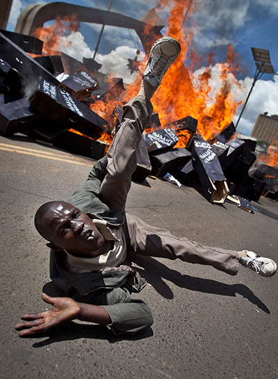 24 hours in pictures: A demonstrator rolls on the ground Nairobi, Kenya