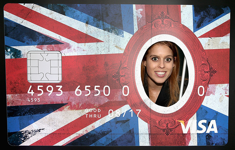 Berlin visit: Princess Beatrice of York peers through a giant credit card