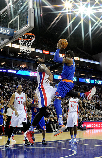 nba 3: Amar'e Stoudemire drives towards the net but is stopped by Andre Drummond