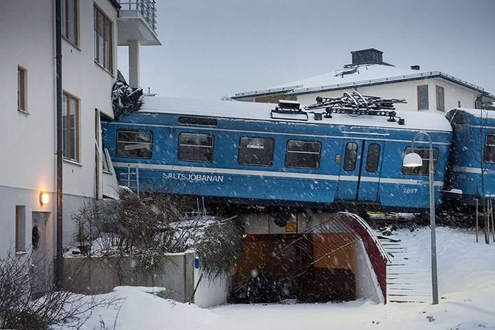 20 Photos: A local train derailed into a residentia