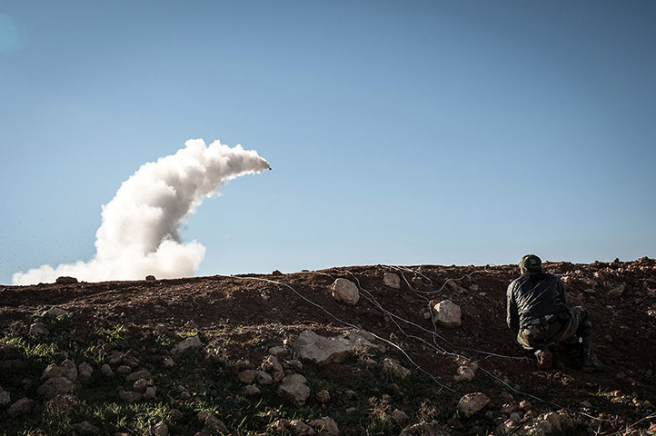 20 Photos: TOPSHOTS Syrian rebels launch a missile