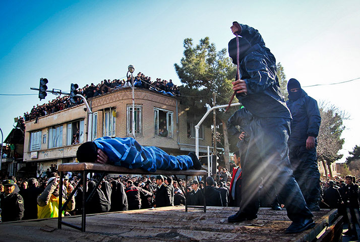 20 Photos: An Iranian officer lashes a man, convicted of rape, in  Sabzevar, Iran