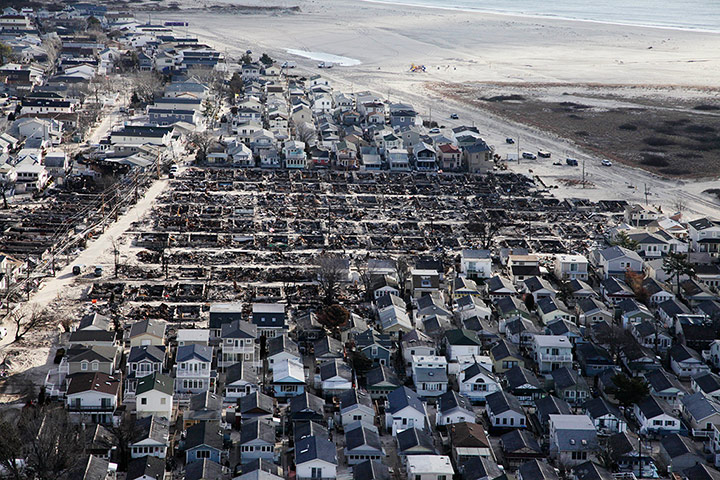 24 Hours: Breezy Point, New York, where more than 100 homes were damaged by a fire caused by Hurricane Sandy