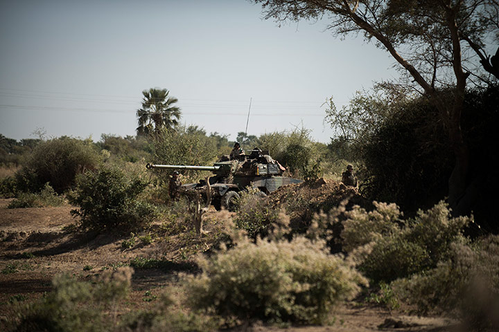 24 Hours: French soldiers stand guard in an armoured vehicle in Markala, Mali