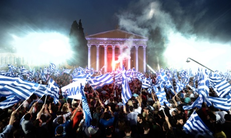 Supporters of Leader of the Greek conservative party New Democracy Antonis Samaras wave flags during a pre-election speech in Athens on May 3, 2012.