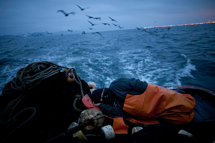 FTA: Rodrigo Abd: Fisherman Walter Richardi naps on the sternd