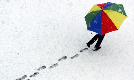 Pedestrian walks across snow in Davos