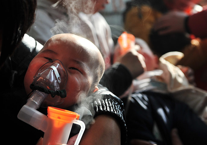 smog crisis in China: Babies given nebulizer therapy as severe air pollution hits Beijing