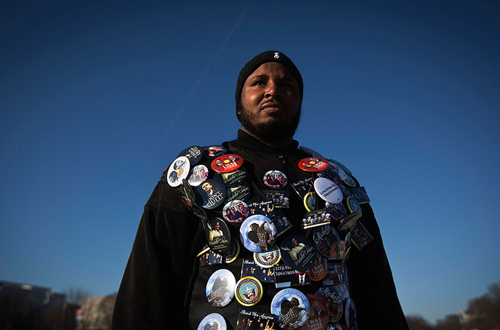 24 hours: Washington, US: A man wears a jacket covered with badges