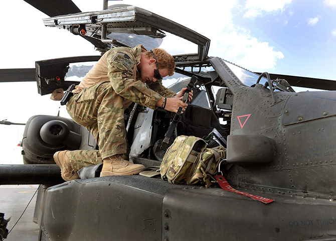 Harry in Afghanistan: Prince Harry with a helicopter
