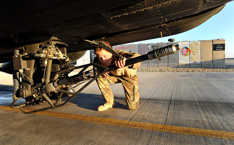 Harry in Afghanistan: Prince Harry does a pre-flight check