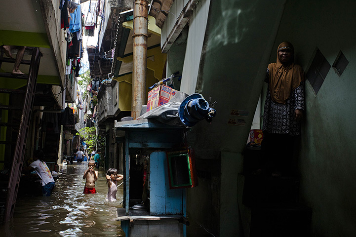 FTA: Ulet Ifansasti: Children play in floodwater in North Jakarta