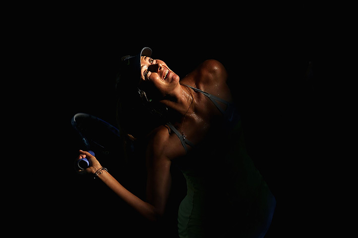 24 hours in pictures:  Maria Sharapova of Russia serves during Australian Open 