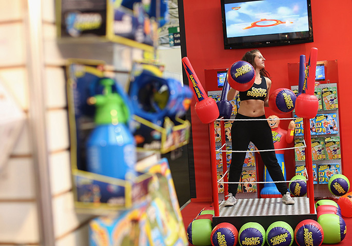 Toy Fair: A woman works out on a trade stand for socker boppers