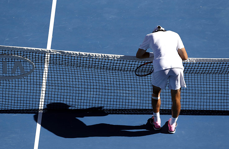 Jeremy Chardy rests on the net