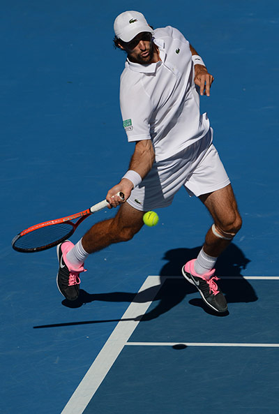 France's Jeremy Chardy plays a return