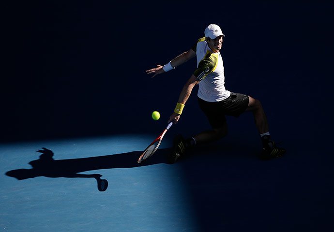 Andy Murray makes a backhand return