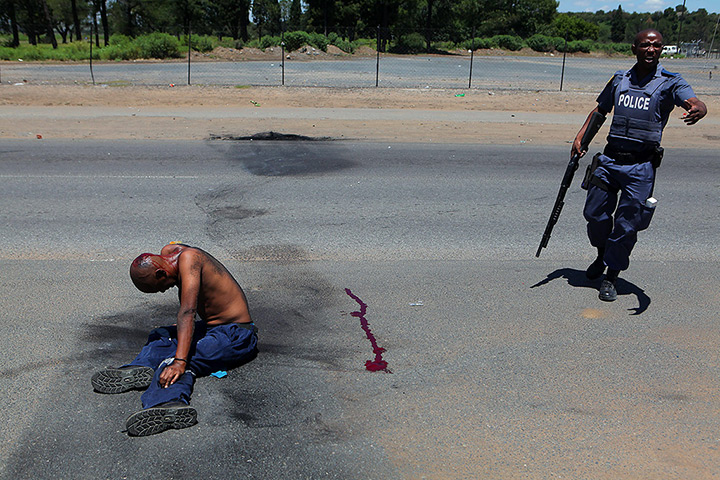24 hours: Sasolburg, South Africa: A protester lies injured by police