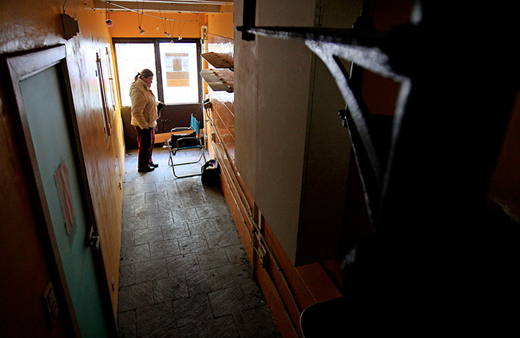 24 hours: Brussels, Belgium: An estate agent waits for visitors at the smallest house