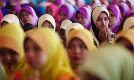 Malaysian Muslims recite a prayer during Maulidur Rasul in Putrajaya outside Kuala Lumpur. Muslims throughout the country are commemorating Maulidur Rasul, the birthday of Prophet Muhammad.