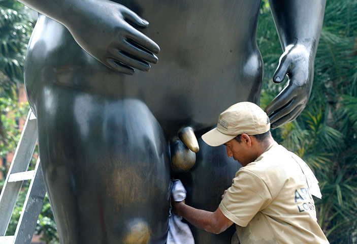 A lighter look: A worker cleans a sculpture 