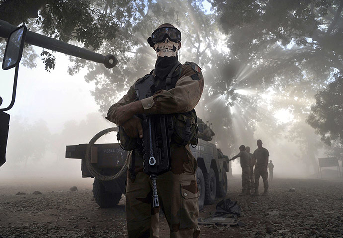 20 Photos: A French soldier wearing a skeleton mask in a street in Niono, Mali