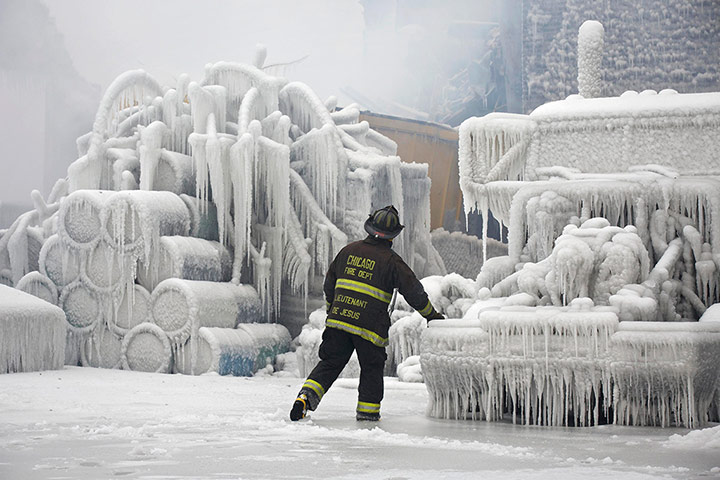 20 Photos: Chicago Fire Department Lieutenant walks around an ice-covered warehouse
