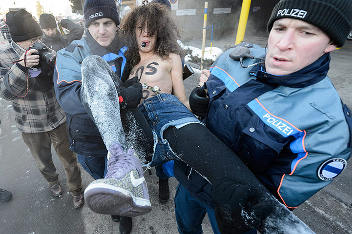 Femen: Police arrest a protester at the entrance to the congress center