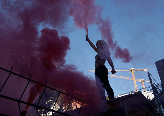 24 Hours: Activist from Femen protests outside World Economic Forum in Davos