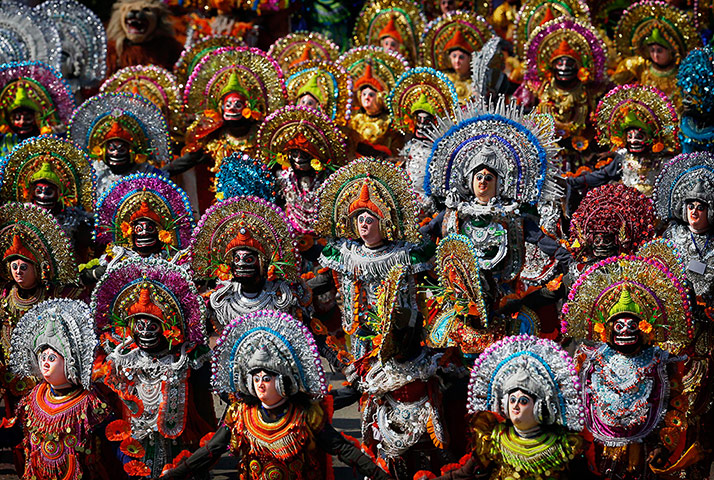24 Hours: Indian students in traditional clothing perform a Purulia Chhau dance