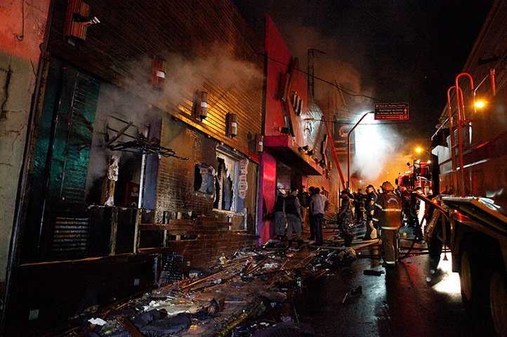 Rio nightclub: Firefighters work to douse the fire at the Kiss nightclub