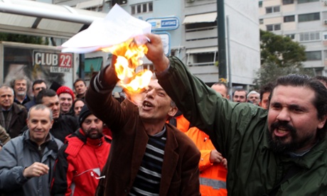 Metro workers burn back-to-work orders in Athens. Protests continued over the weekend in support of the workers after the government threatened them with arrest on Friday, ending a nine-day strike.