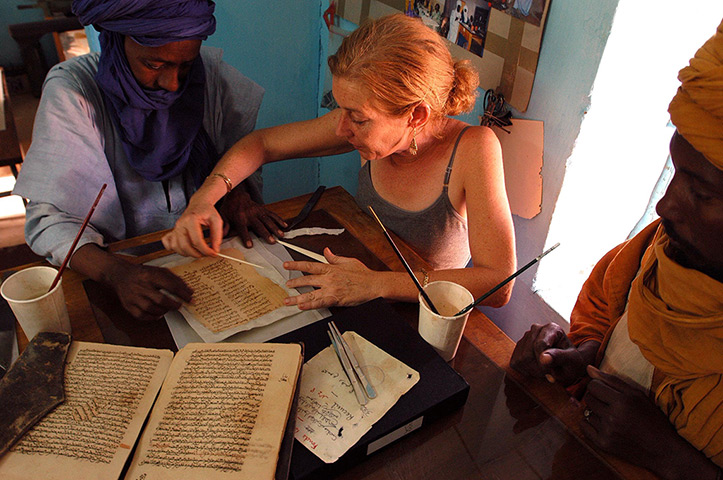 Ahmed Baba Institute: tephanie Diakte in the manuscript restoration room