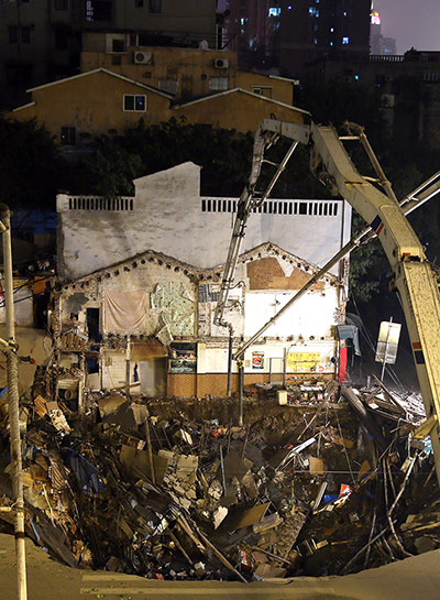 Sinkhole gallery: Rescuers at the scene of huge cave in