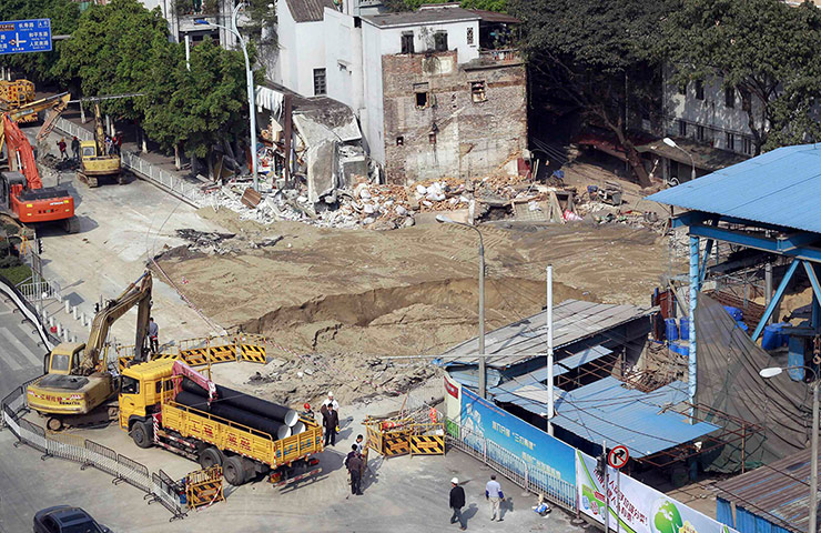 Sinkhole gallery: An area is seen cordoned off after a second cave-in 