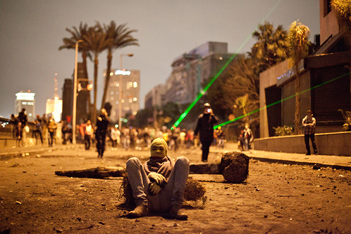 24 hours: A protester takes in Cairo, Egypt